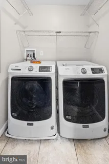 a utility room with washer and dryer