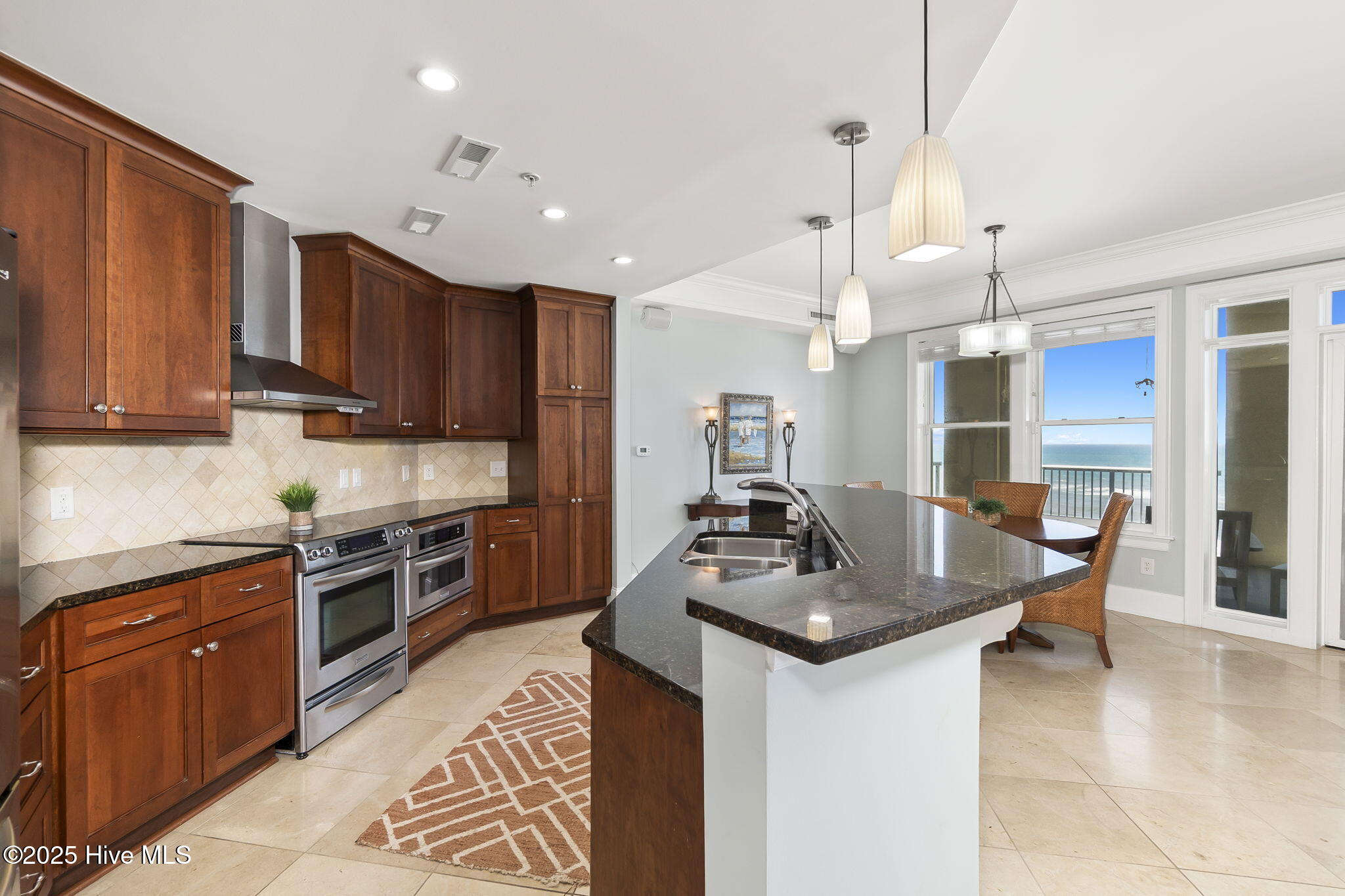 1435 Salter Path Road, Unit G4 GRANDE VILLAS Indian Beach, NC 28512 - Photo 13 of 41 Kitchen w/ island & additional seating
