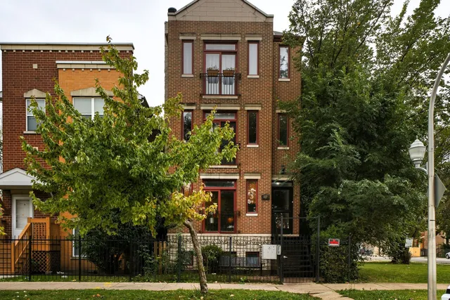 front view of a building with a garden