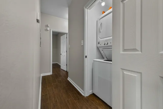 a view of a hallway and wooden floor