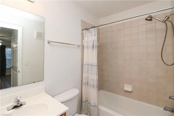 a bathroom with a sink and a shower