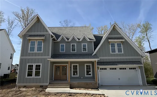 a view of a brick house with large windows