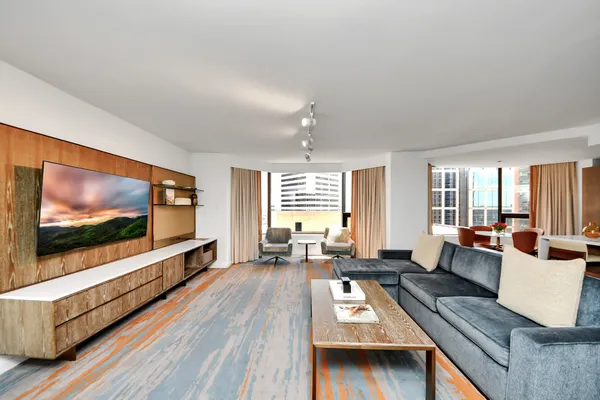 a living room with furniture and a flat screen tv
