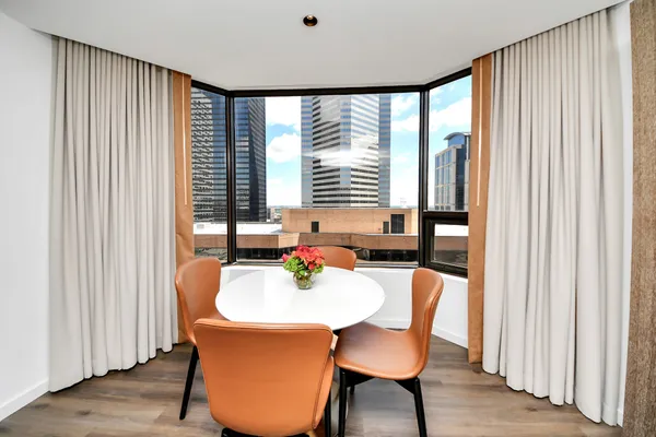 a dining room with furniture and window