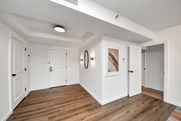a view of a livingroom with wooden floor