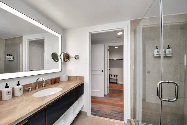 a kitchen with a sink and a refrigerator