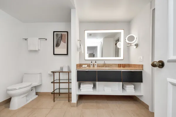 a en suite bathroom with a sink and a mirror