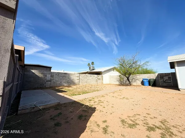 a view of a backyard of the house