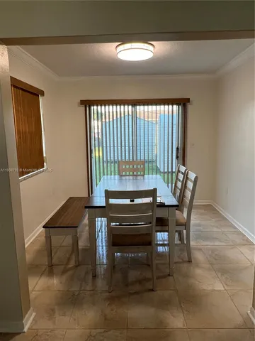 a view of a workspace with furniture