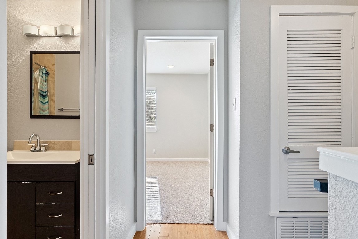 3601 Menchaca Road, Unit 117 Austin, TX 78704 - Photo 18 of 25 a bathroom with a sink and a mirror