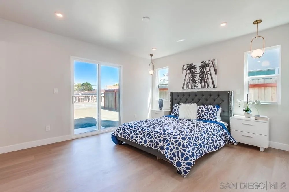 122 Lancer Avenue Oceanside, CA 92058 - Photo 21 of 67 a bedroom with a bed and a painting on the wall