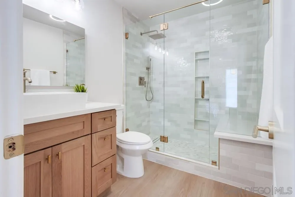 122 Lancer Avenue Oceanside, CA 92058 - Photo 24 of 67 a bathroom with a shower toilet and sink