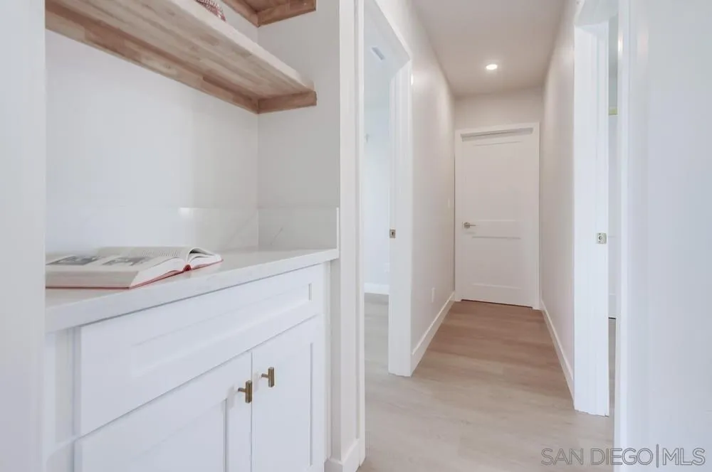 122 Lancer Avenue Oceanside, CA 92058 - Photo 25 of 67 a utility room with cabinets washer and dryer