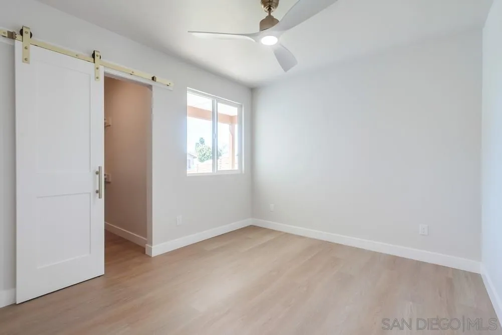 122 Lancer Avenue Oceanside, CA 92058 - Photo 29 of 67 an empty room with windows and fan