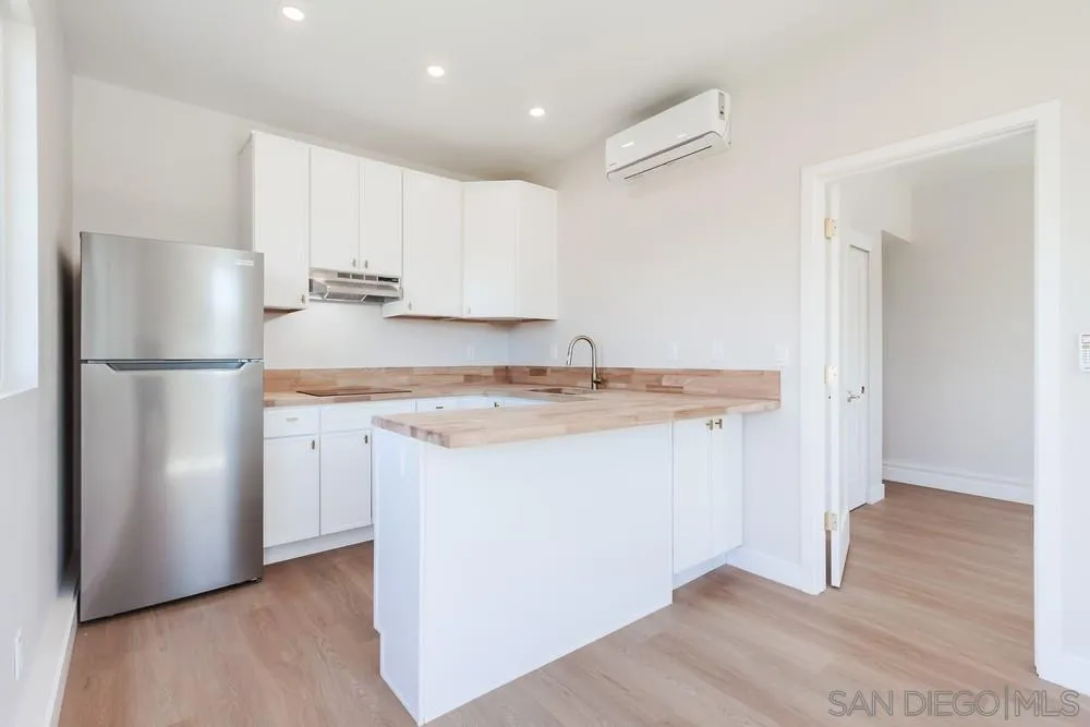 122 Lancer Avenue Oceanside, CA 92058 - Photo 35 of 67 a kitchen with stainless steel appliances granite countertop a refrigerator and a stove top oven
