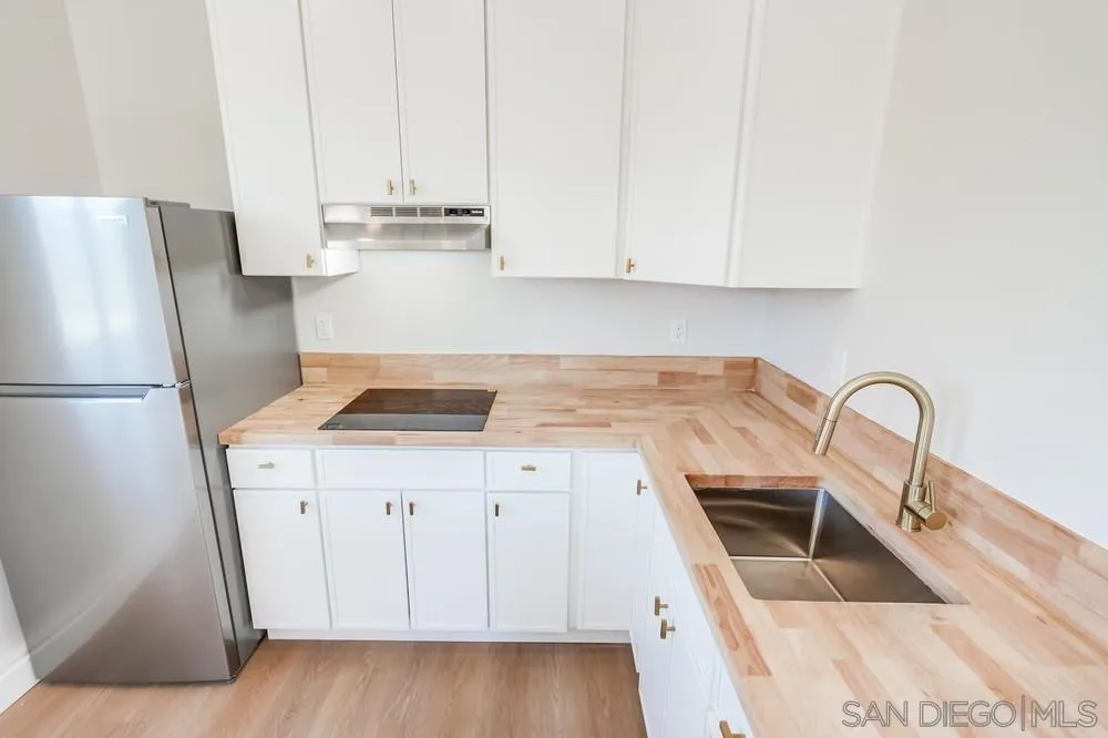 122 Lancer Avenue Oceanside, CA 92058 - Photo 37 of 67 a kitchen with stainless steel appliances granite countertop a stove a sink and a refrigerator