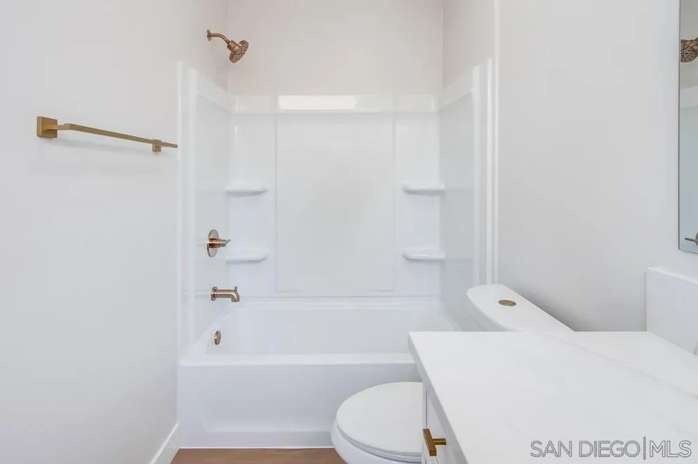 122 Lancer Avenue Oceanside, CA 92058 - Photo 44 of 67 a bathroom with a toilet and a bath tub