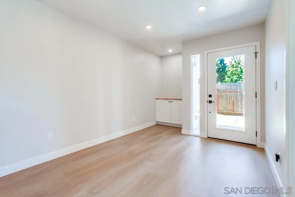 122 Lancer Avenue Oceanside, CA 92058 - Photo 54 of 67 an empty room with wooden floor and windows