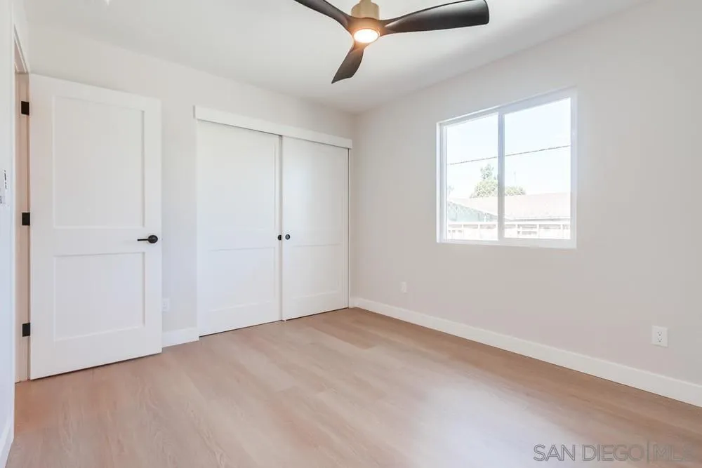 122 Lancer Avenue Oceanside, CA 92058 - Photo 63 of 67 an empty room with windows and ceiling fan