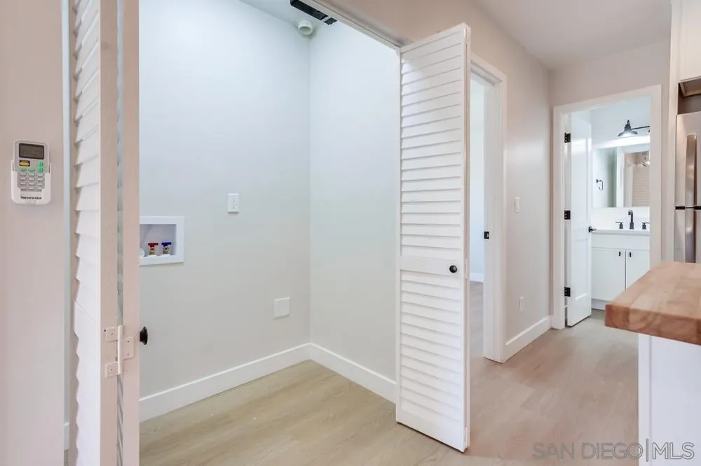 122 Lancer Avenue Oceanside, CA 92058 - Photo 64 of 67 a view of a hallway with closet and cabinet