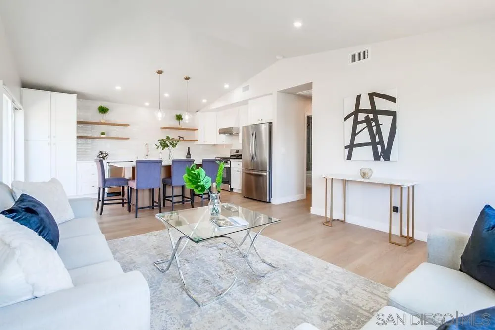 122 Lancer Avenue Oceanside, CA 92058 - Photo 9 of 67 a living room with furniture kitchen view and a refrigerator