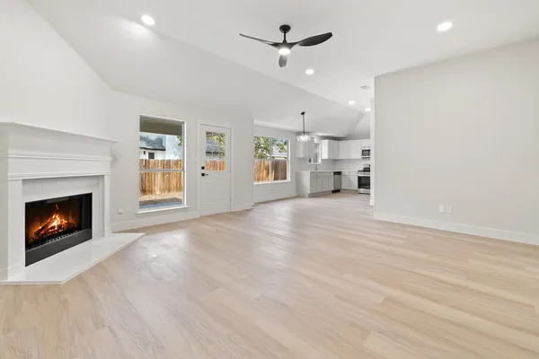 a view of a livingroom with fireplace and a fireplace