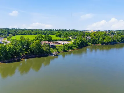 a view of a lake with houses in the back