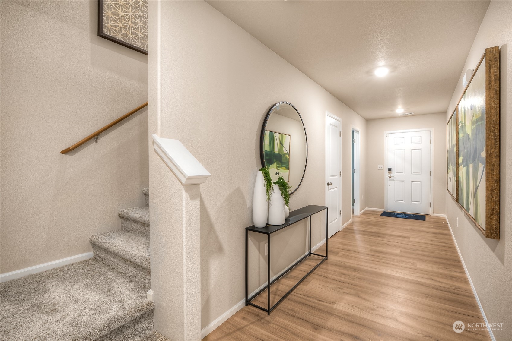 1055 17th Avenue, Unit 177 Sultan, WA 98294 - Photo 2 of 18 a view of a hallway view with staircase