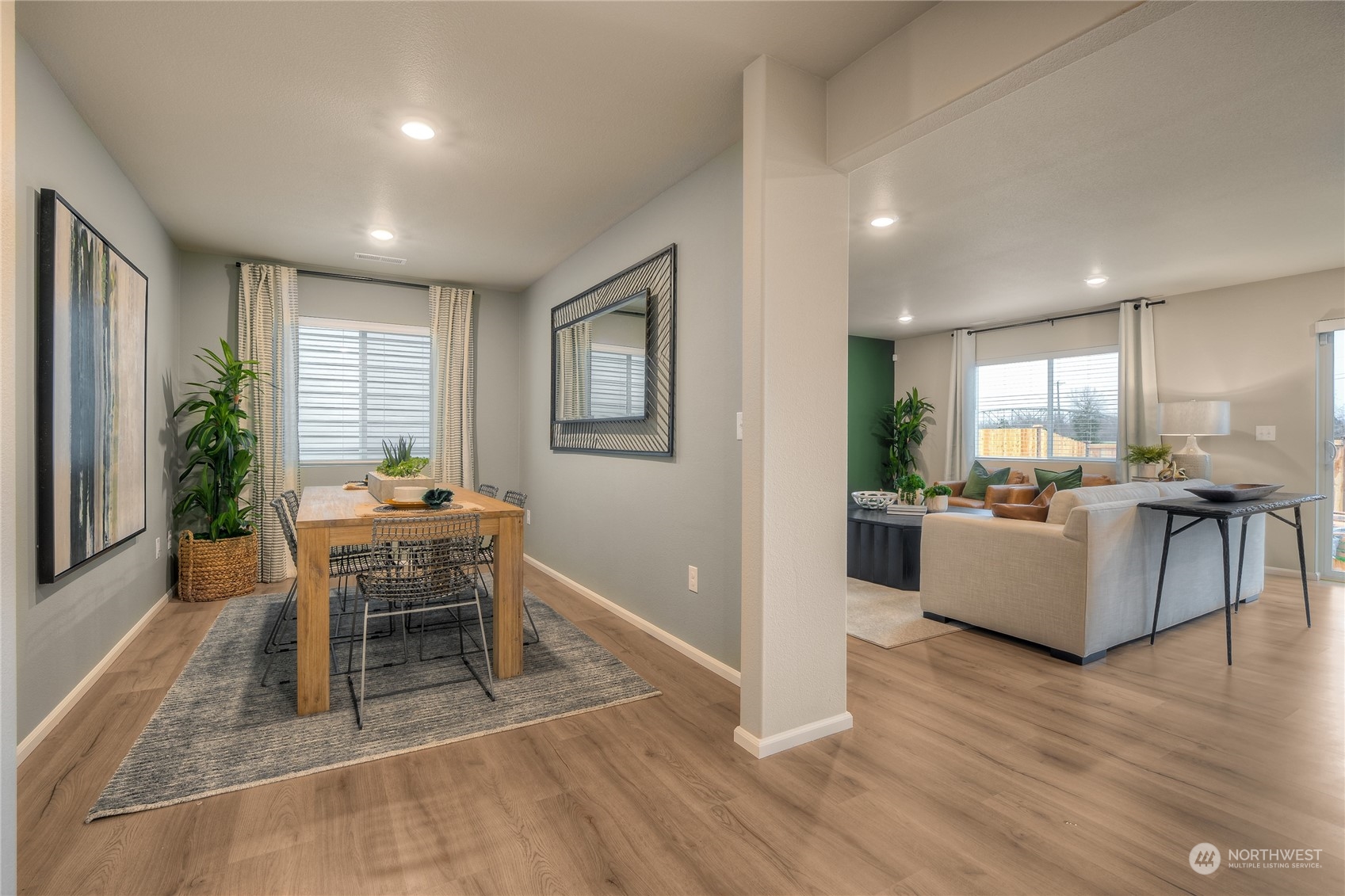 1055 17th Avenue, Unit 177 Sultan, WA 98294 - Photo 3 of 18 a dining room with furniture and wooden floor