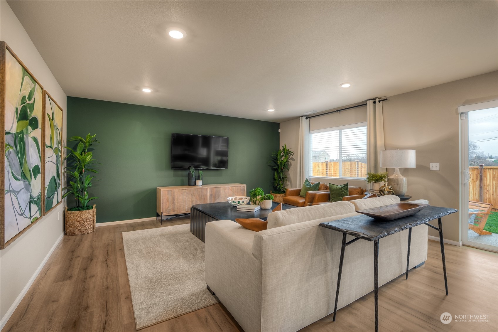 1055 17th Avenue, Unit 177 Sultan, WA 98294 - Photo 4 of 18 a living room with furniture and a flat screen tv