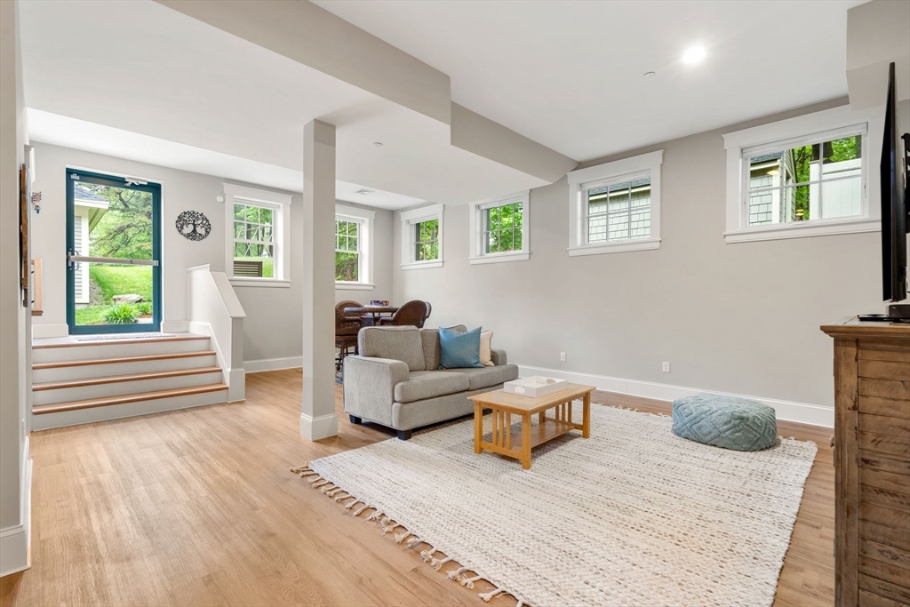 73 Pepperell Road, Unit C Groton, MA 01450 - Photo 23 of 35 a living room with furniture and a window
