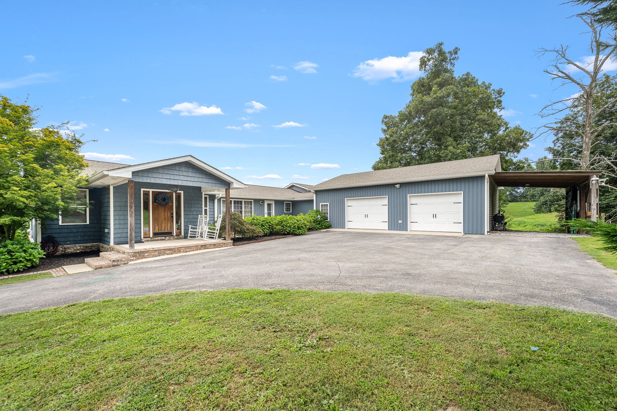 a front view of house with yard and green space