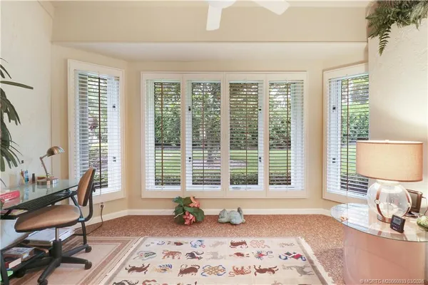 a bedroom with furniture and a window