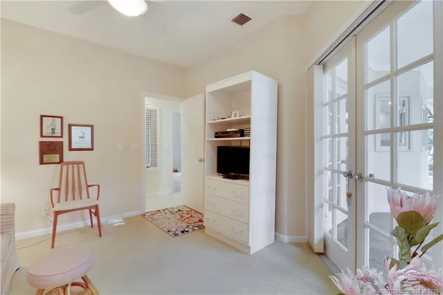 a view of a livingroom with furniture and windows