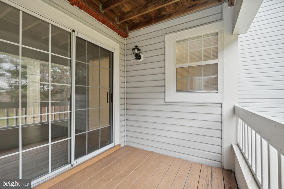 8573 Falls Run Road, Unit E Ellicott City, MD 21043 - Photo 20 of 21 a view of a balcony with a window