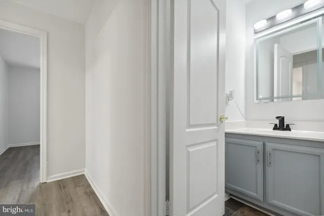 a bathroom with a sink and mirror