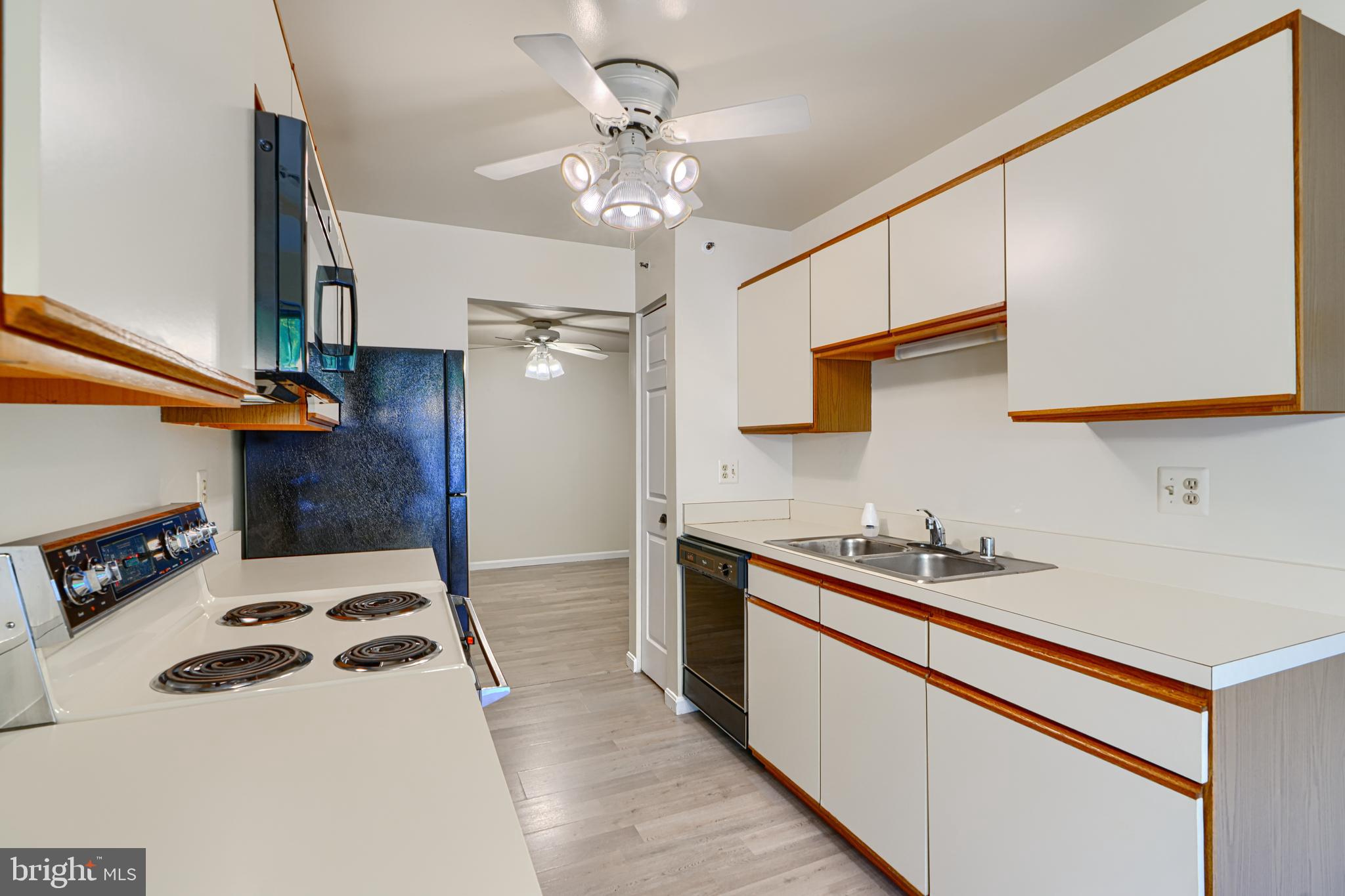 201 Star Pointe Court, Unit 1A Abingdon, MD 21009 - Photo 14 of 31 a kitchen with a sink a stove and cabinets