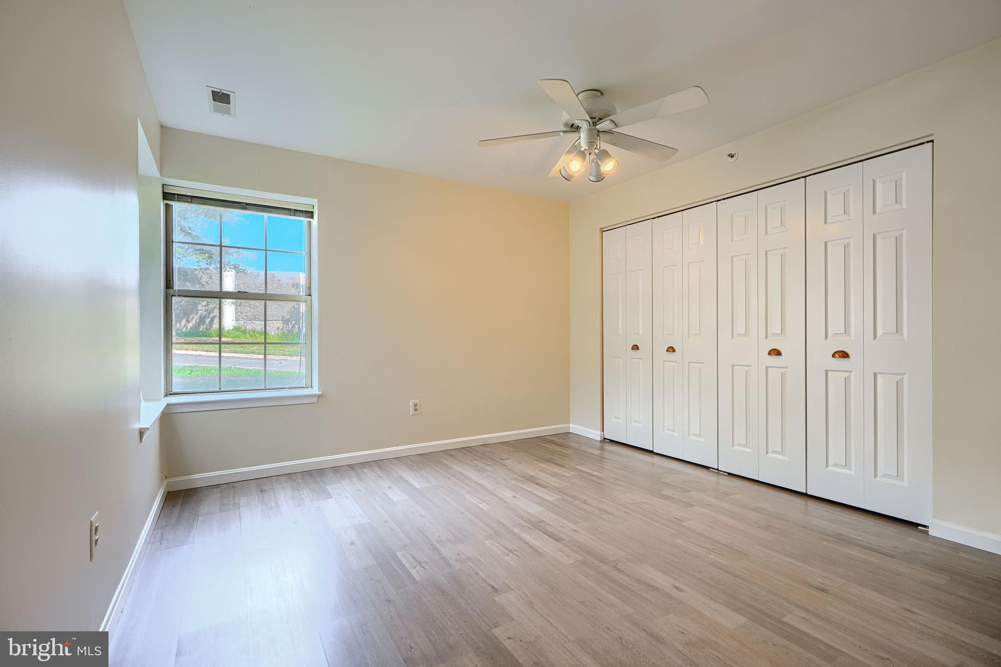 201 Star Pointe Court, Unit 1A Abingdon, MD 21009 - Photo 15 of 31 a view of an empty room with wooden floor and a window