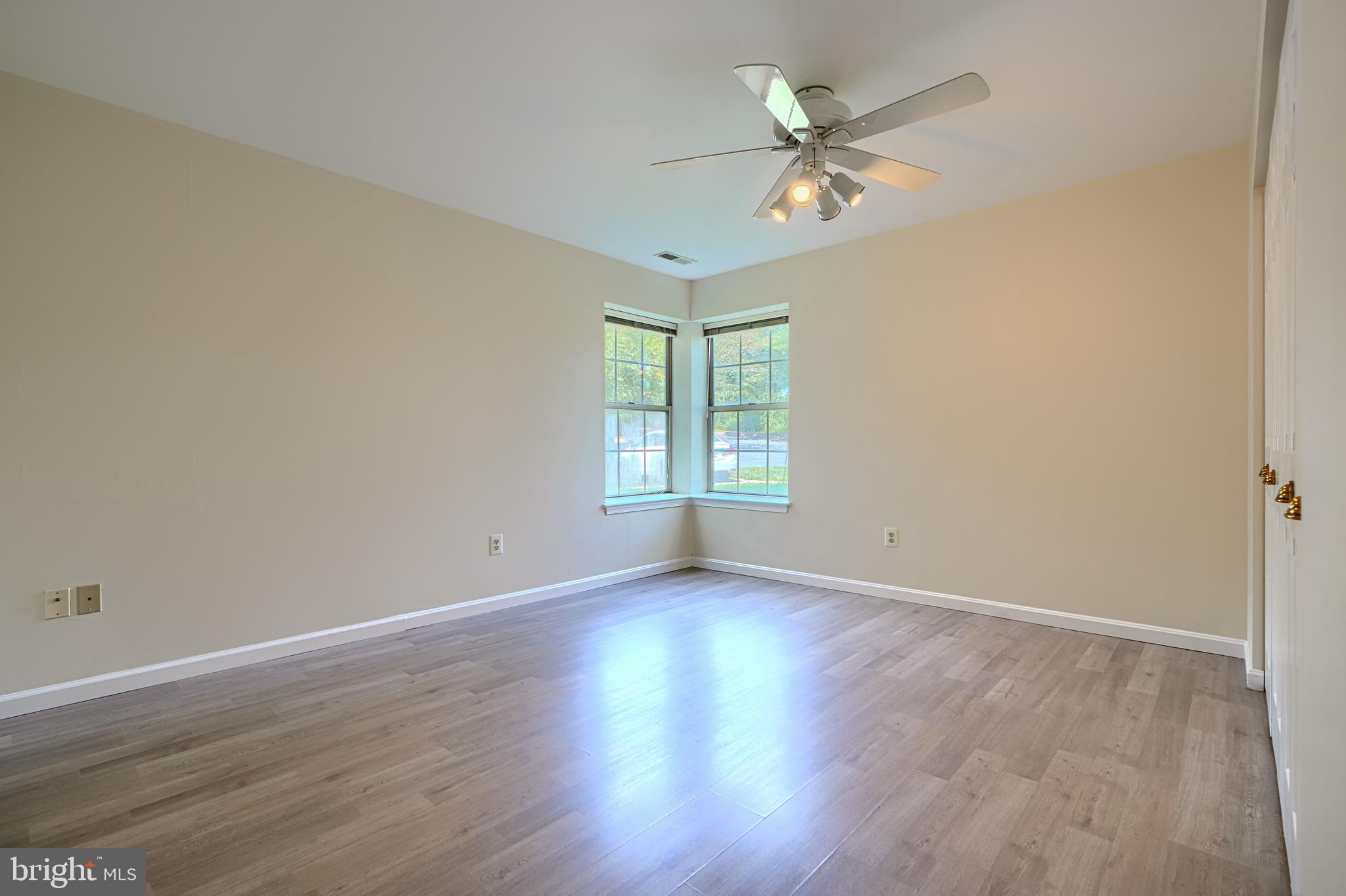 201 Star Pointe Court, Unit 1A Abingdon, MD 21009 - Photo 16 of 31 a view of an empty room with wooden floor and a window