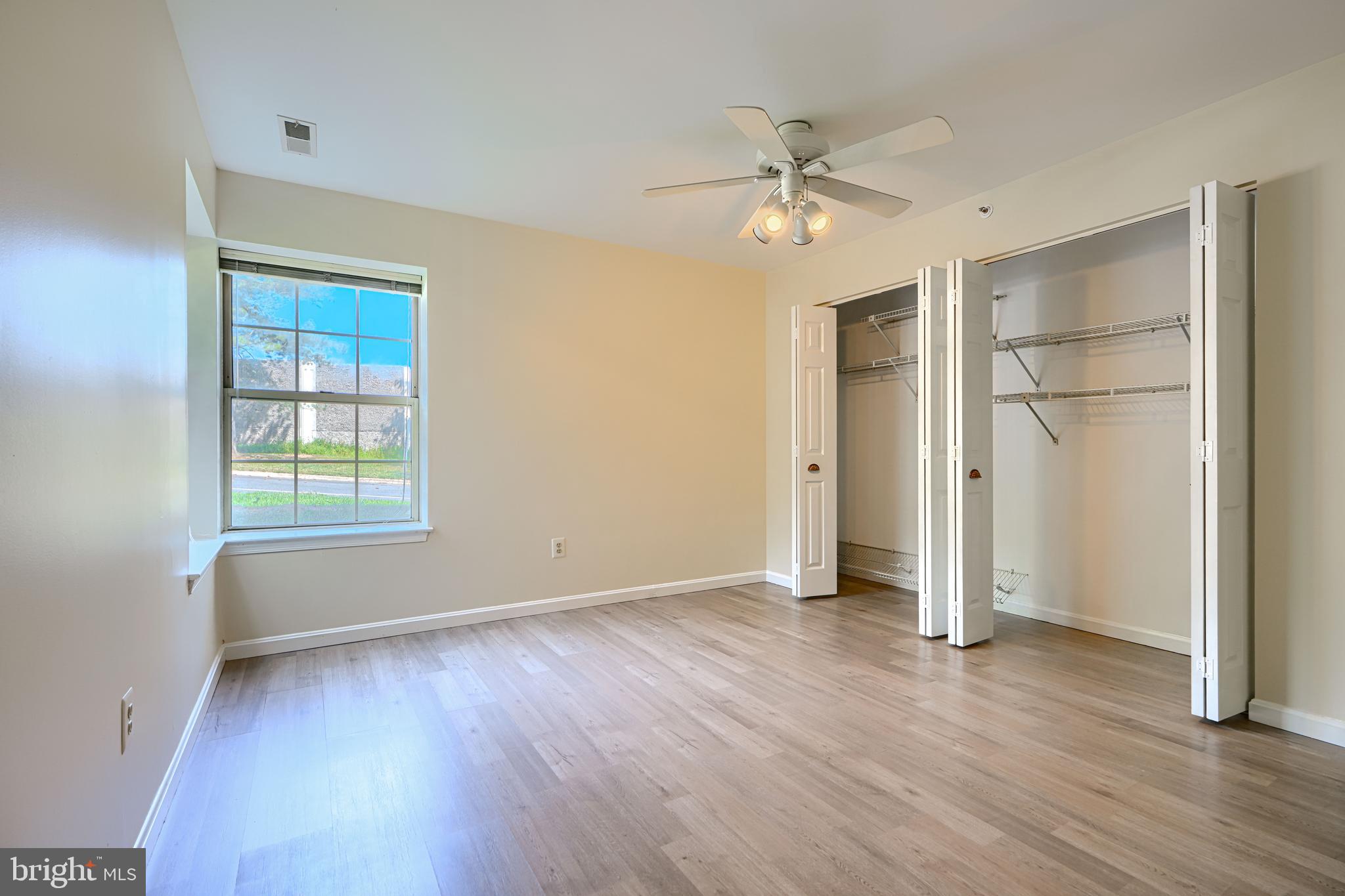 201 Star Pointe Court, Unit 1A Abingdon, MD 21009 - Photo 17 of 31 a view of an empty room with wooden floor and a window