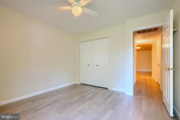 an empty room and wooden door