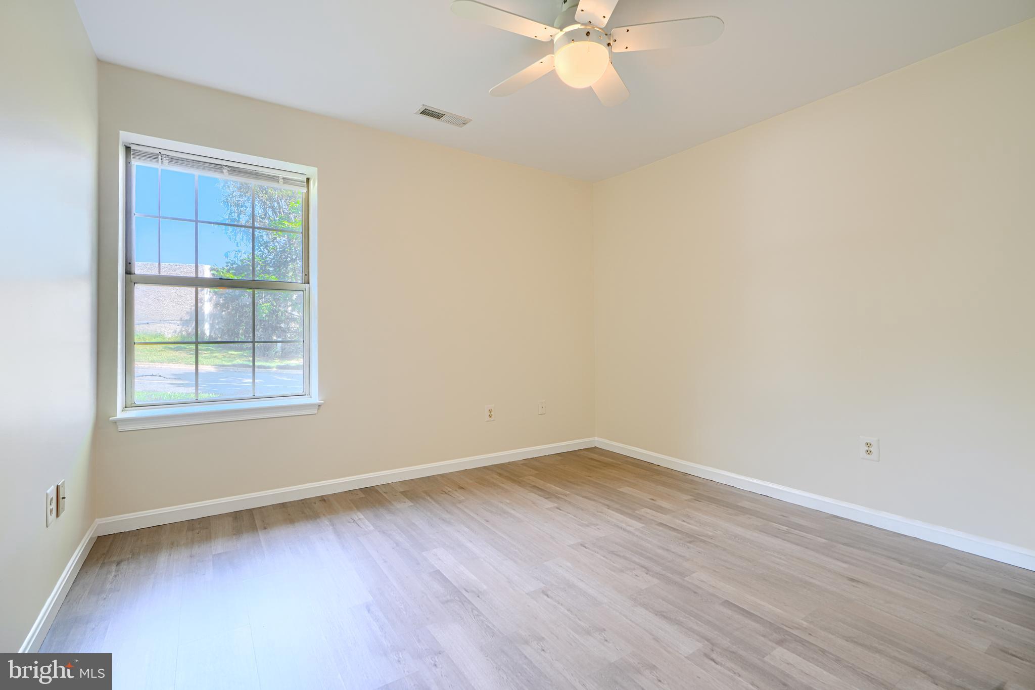 201 Star Pointe Court, Unit 1A Abingdon, MD 21009 - Photo 22 of 31 an empty room with wooden floor and windows