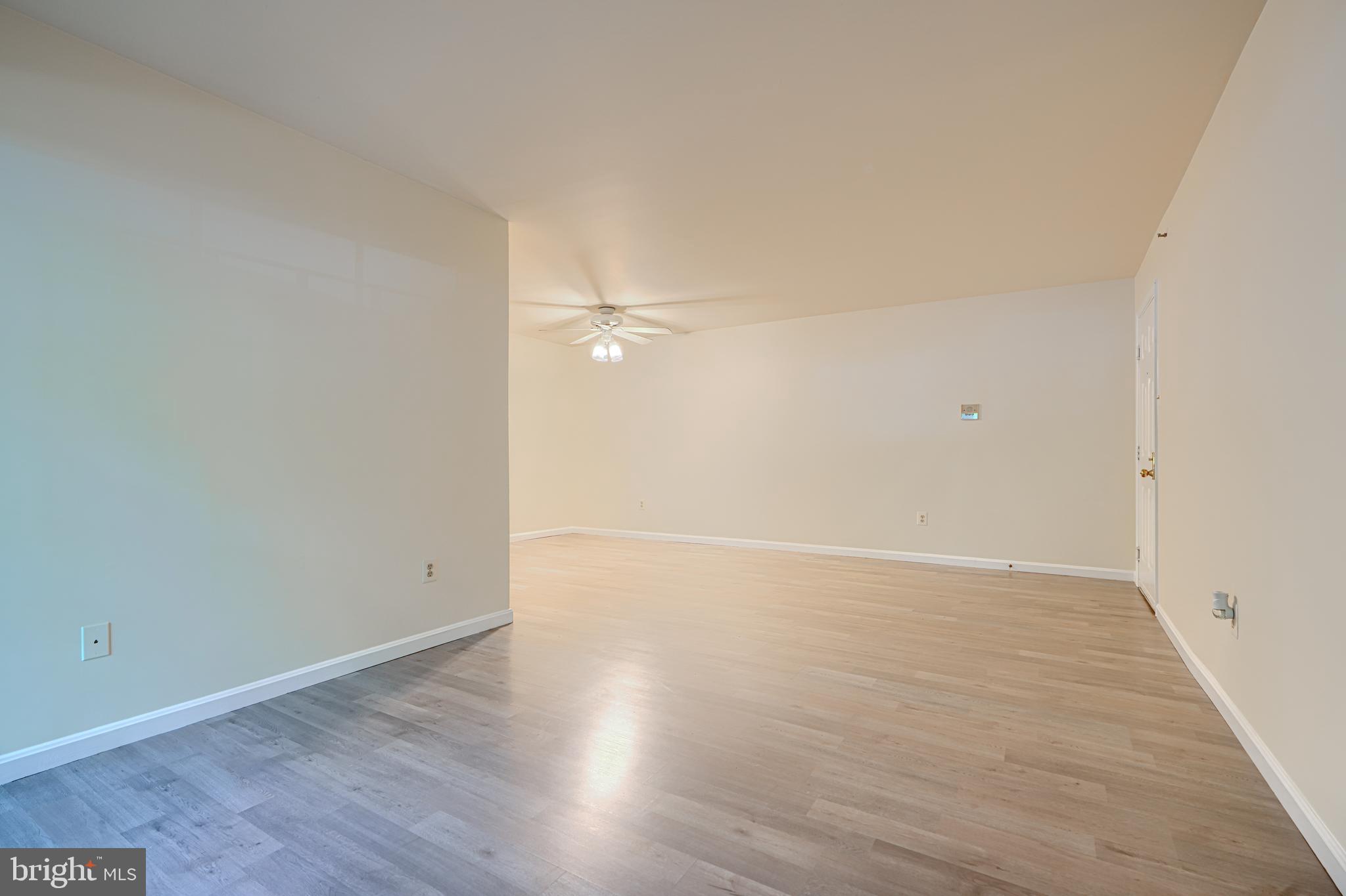 201 Star Pointe Court, Unit 1A Abingdon, MD 21009 - Photo 8 of 31 a view of an empty room with wooden floor