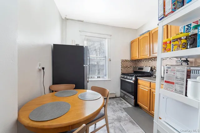 a kitchen with stainless steel appliances granite countertop a refrigerator a stove top oven a sink and dishwasher