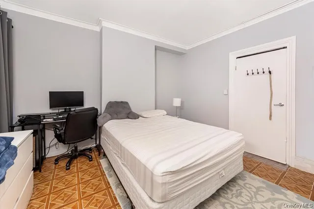 a bedroom with a bed and a desk