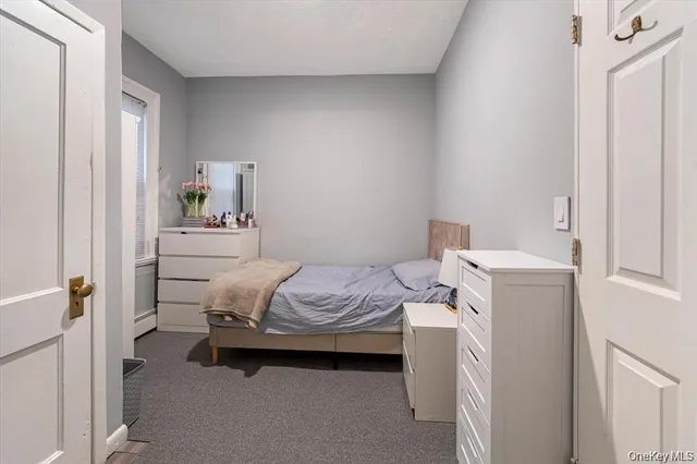 a room with a bed and a window