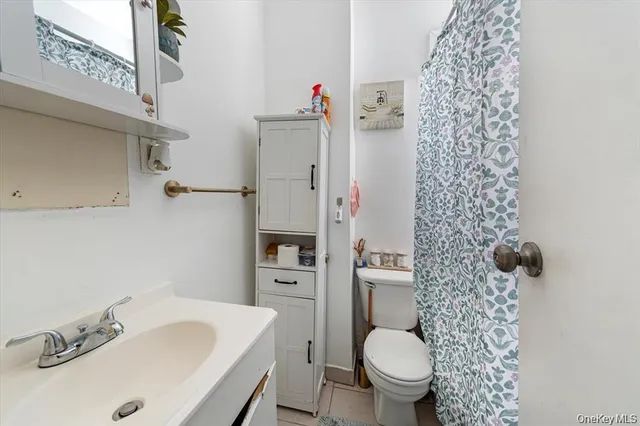 a bathroom with a sink toilet and a shower