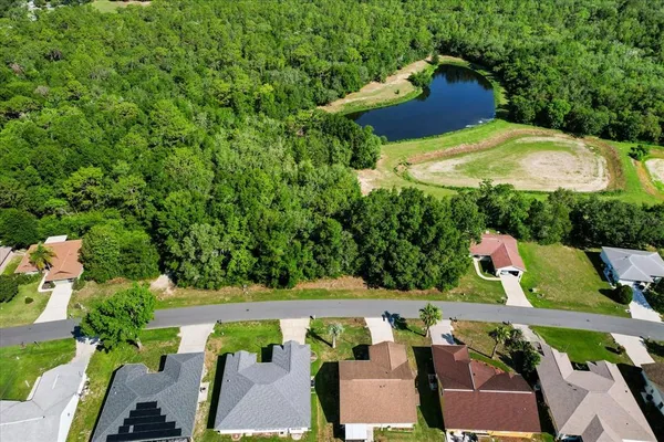 an aerial view of a house with outdoor space