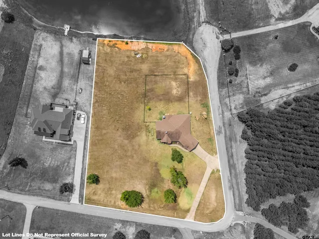 a living room with furniture kitchen and a wooden floor