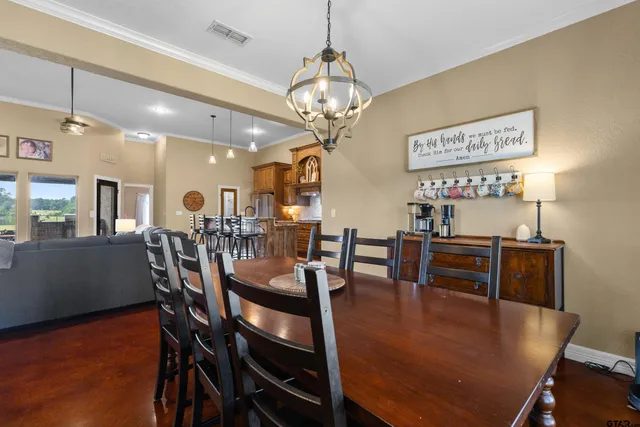 a bathroom with a granite countertop sink and a bathtub
